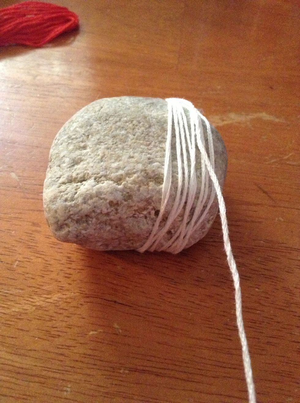 Keep wrapping the string around your rock