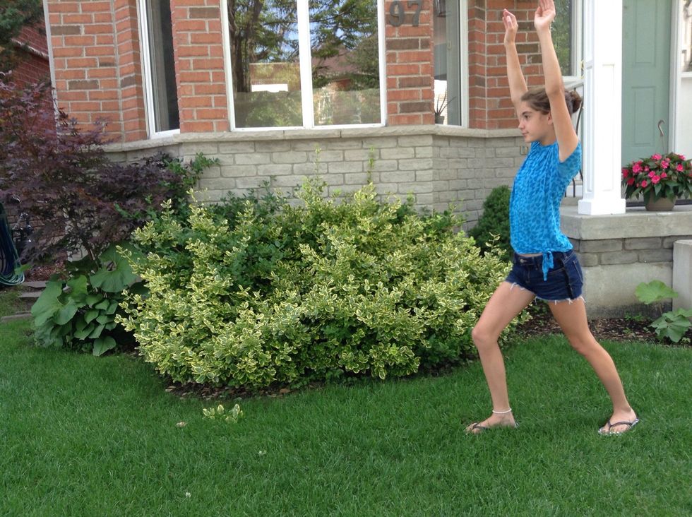 Keep your arms up by your ears and to a lunge