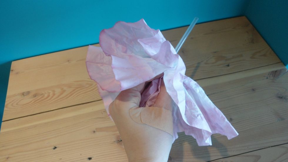 Keep your hand on the filter and fold the excess back towards you.