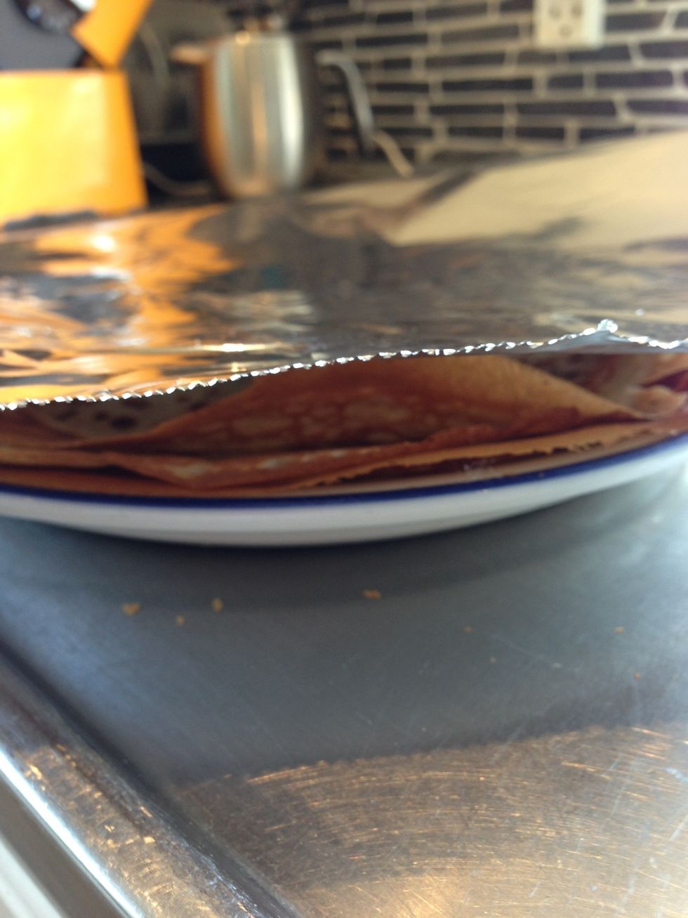 Keep your pancakes under a cover of foil, so they won't get cold.