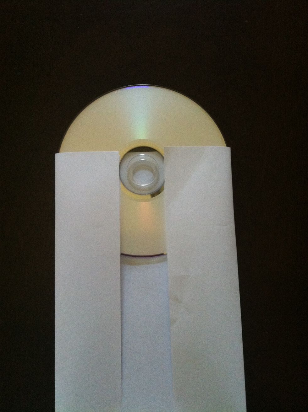 Keeping the cd in the same position, fold the edges inward
