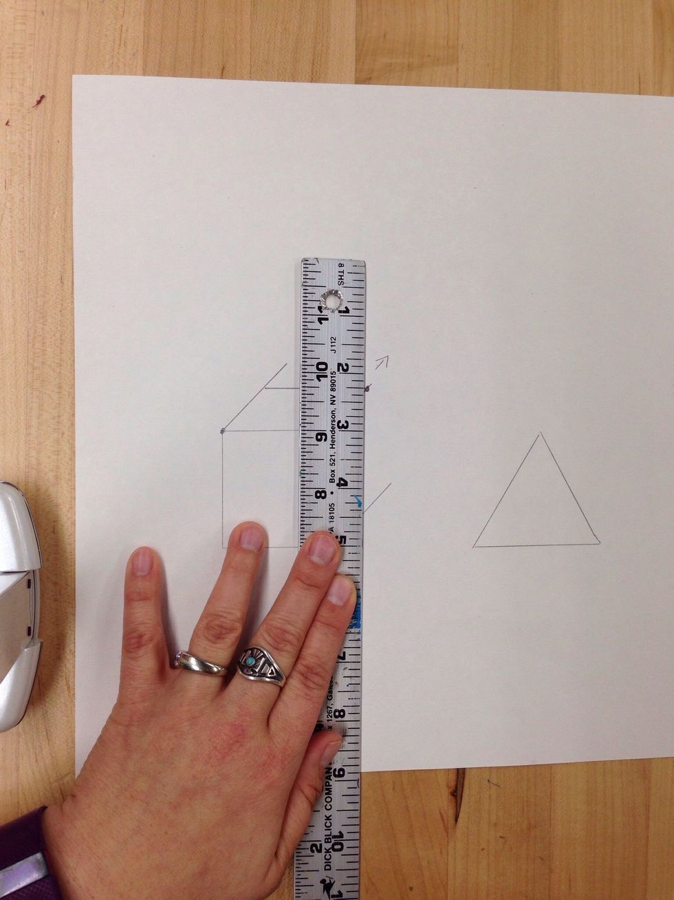 Keeping the same angle now move the ruler over to meet with the corner of the horizontal line you just drew.
