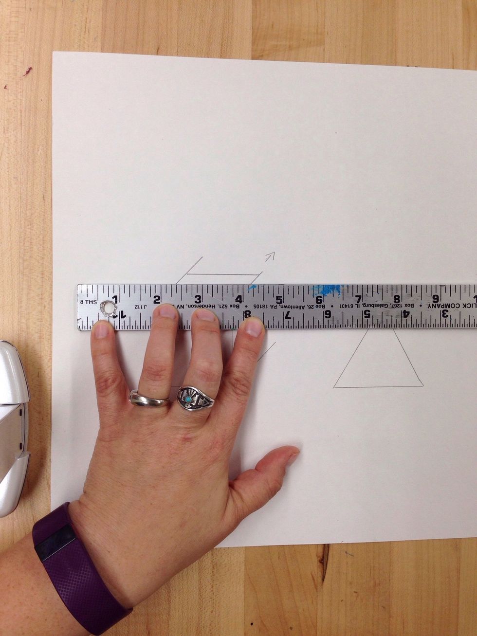 Keeping the same angle, push the ruler up to the top of the box and draw a line.
