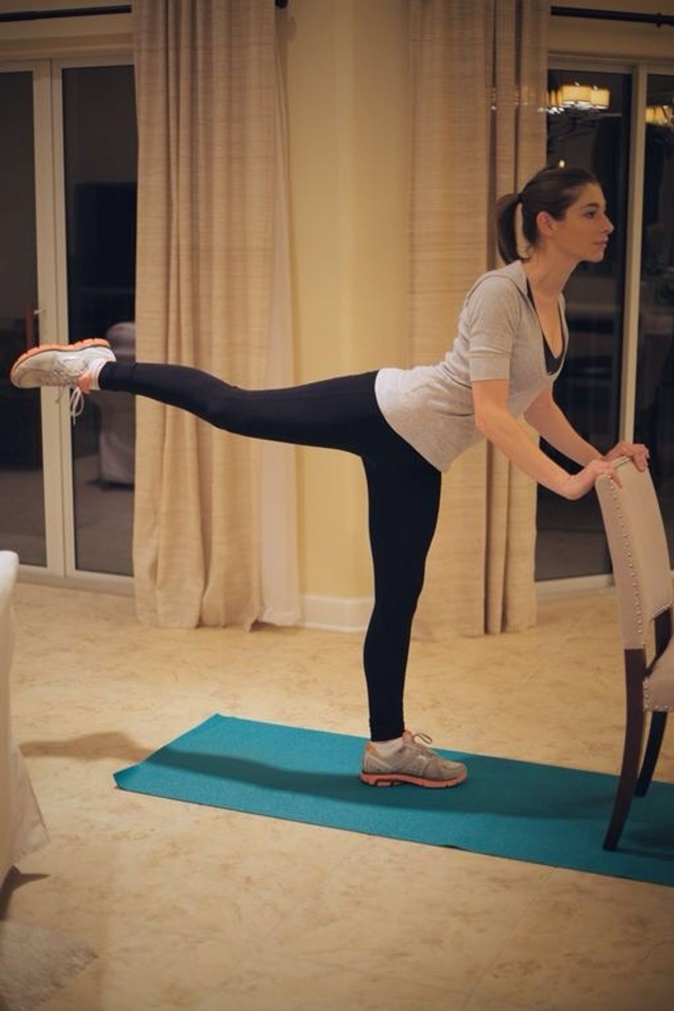 Kick leg as straight as possible with toes pointed. Then go back to starting position. Make sure to keep shoulders down and back straight with even hips