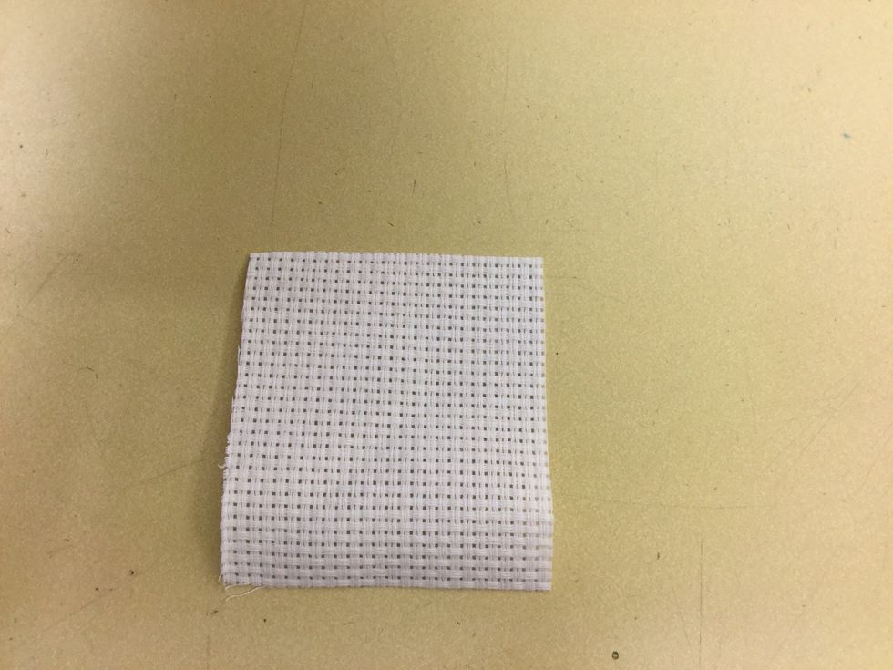 Klipp ut en tygbit, aidav\u00e4v, 7x7cm.