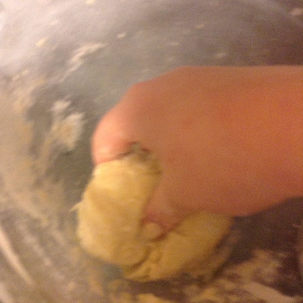 Knead it. It should all come together, if not add more milk.