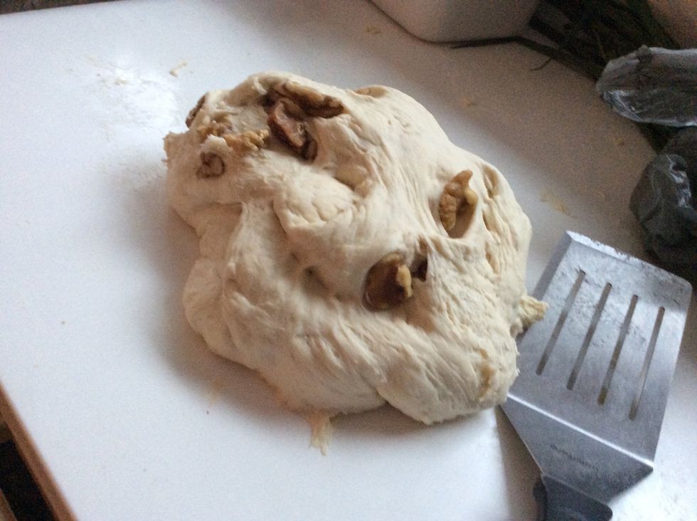 Knead mixture until satisfactory, roll it out, place fogs and walnuts and roll it up again, continue kneading the dough or adding flour