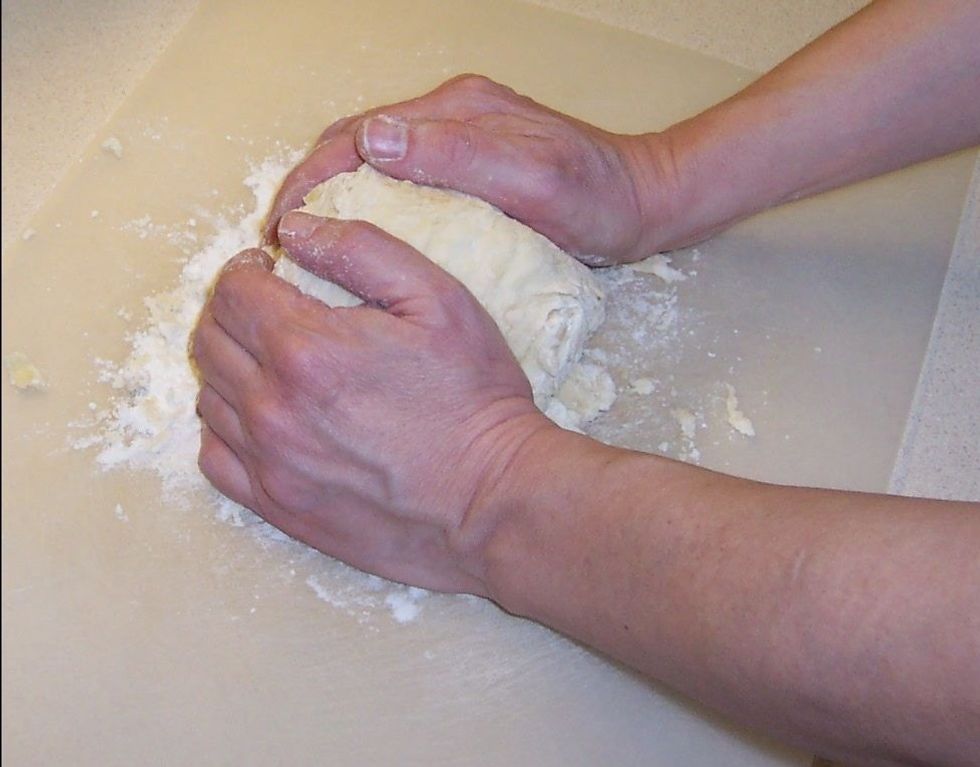 Knead on a floured board until smooth and elastic. This takes about five minutes.
