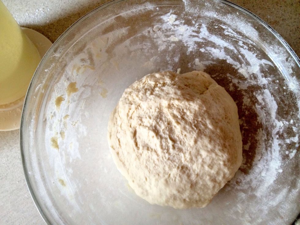 Knead the dough and add flour till it becomes almost dry and stops sticking to your hands.