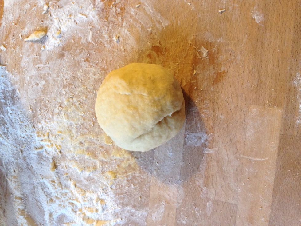 Knead the dough for about 10min into a smooth elastic ball. Wrap the ball in plastic foil and leave it to rest in the fridge for half an hour.