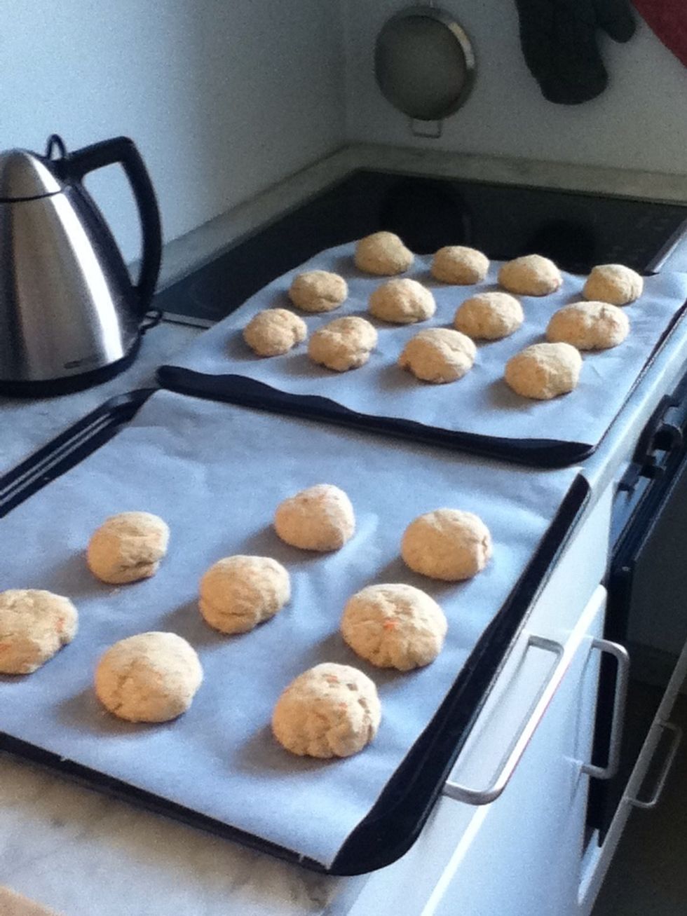 Knead the dough. Place the buns on a cookie sheet and leave them for another 20min.