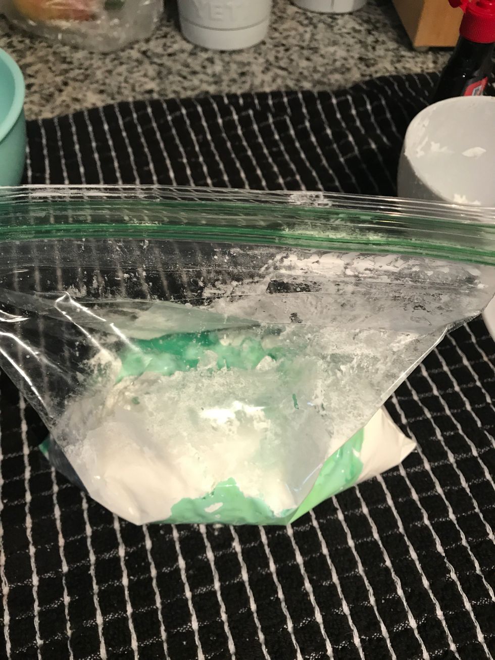Knead the ziplock bag to thoroughly mix the water, food coloring, and cornstarch.