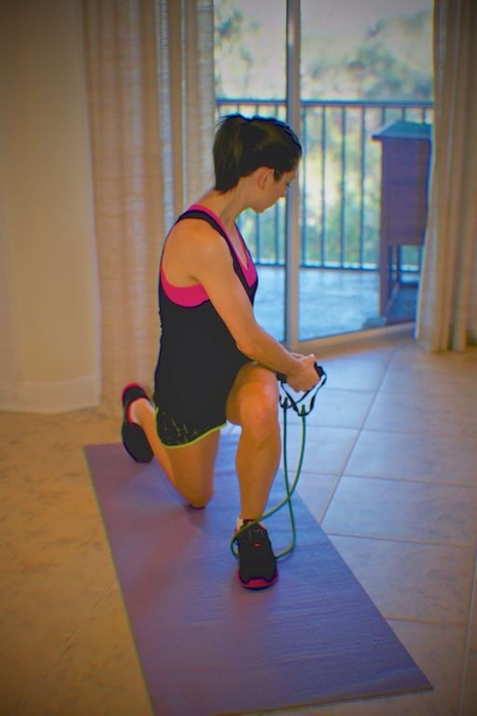 Kneel Down-Chop: Kneel down, bringing the right leg behind and to the ground while rotating torso so arms are at left hip. Return to starting and alternate sides per set.