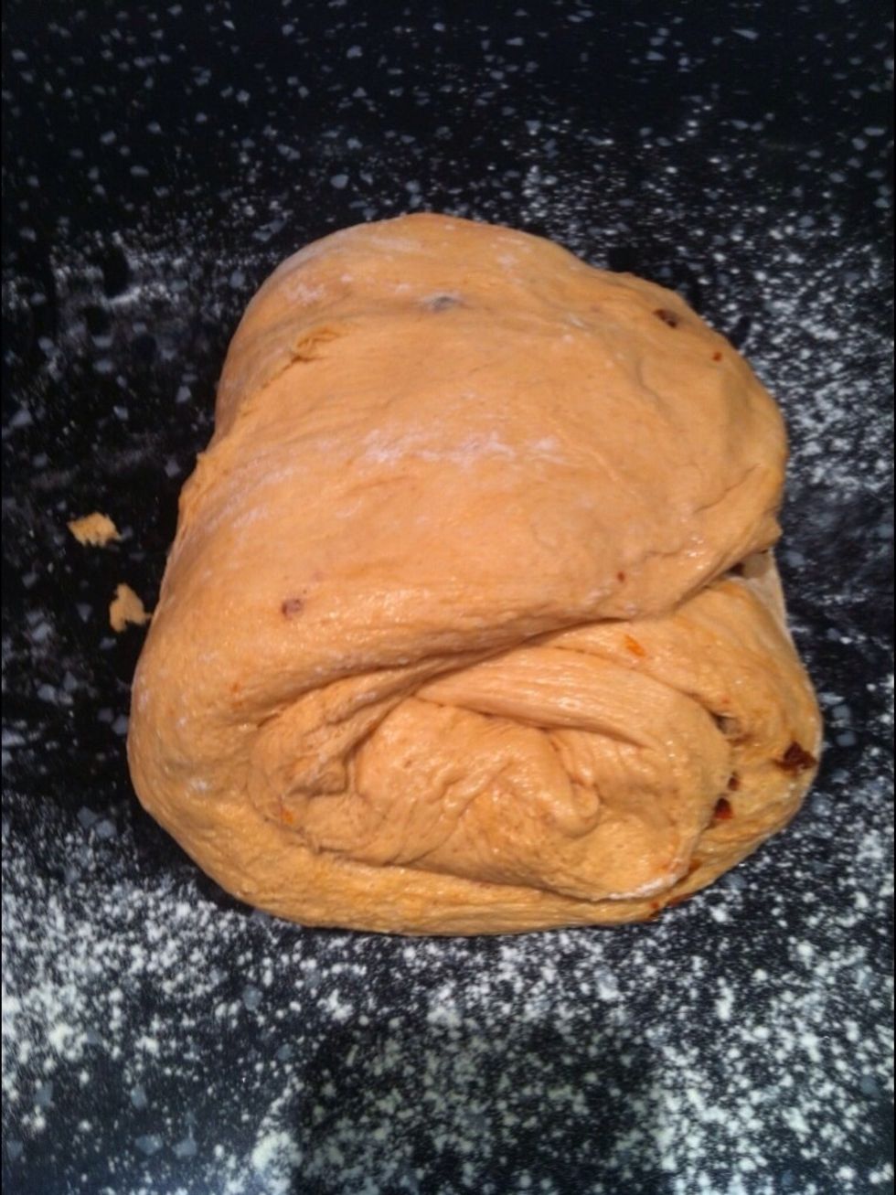 Knock back the dough by needing for a minute