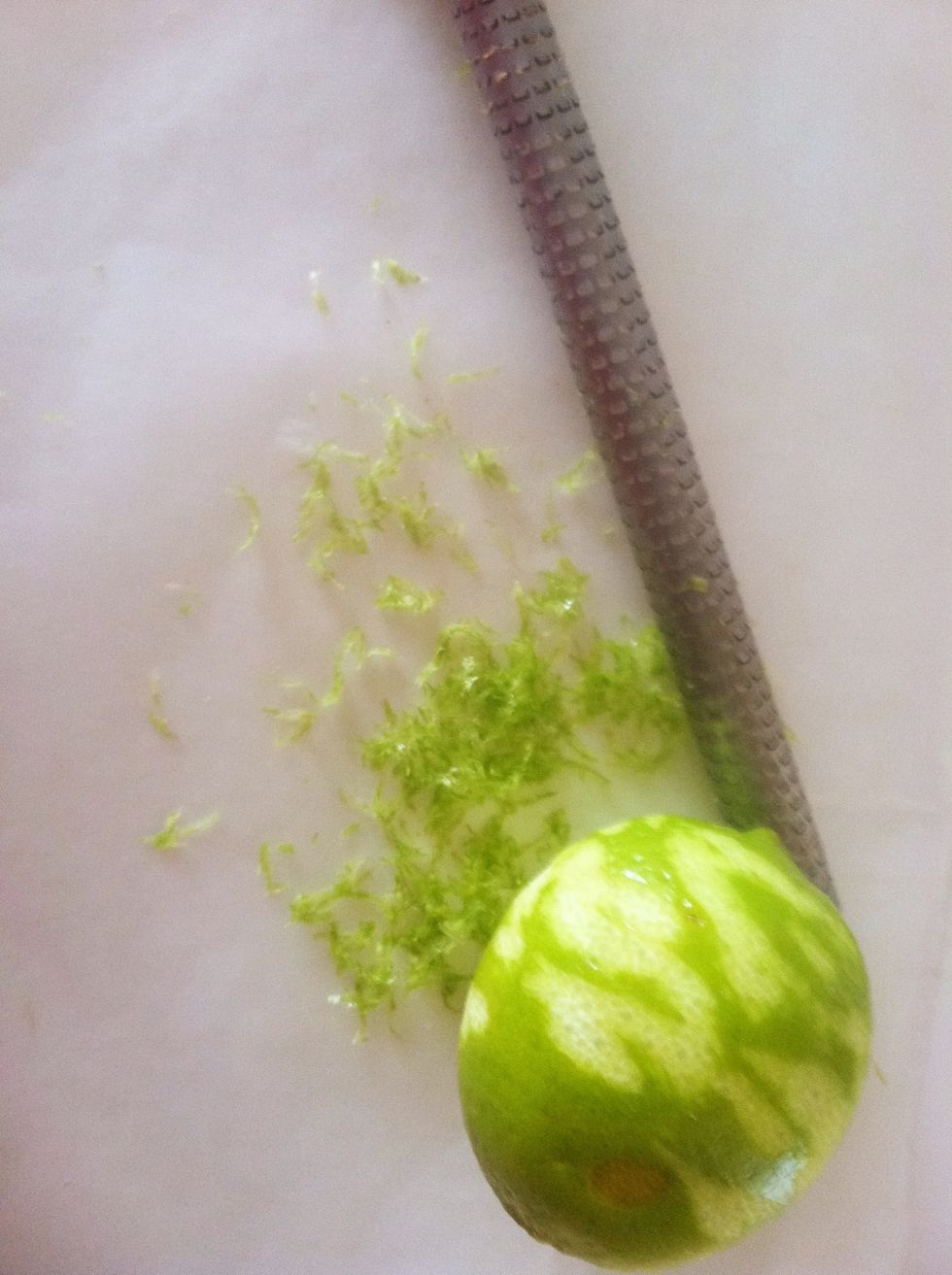 Knock the round rasp against counter to release the zest.