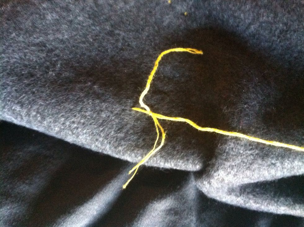Knot your next piece of thread to the one you've been using.