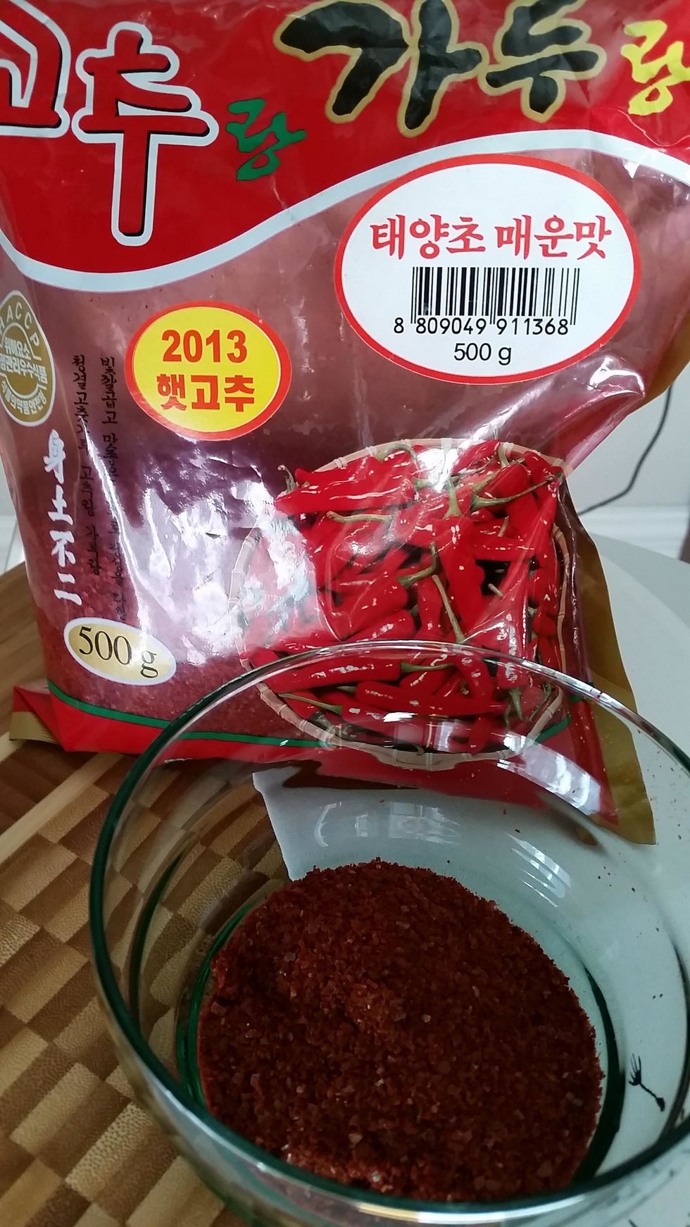 Kochukaru (korean kimchi pepper). Add 1-5 tablespoons to the paste depending how spicy you want your kimchi ( kimchee)
