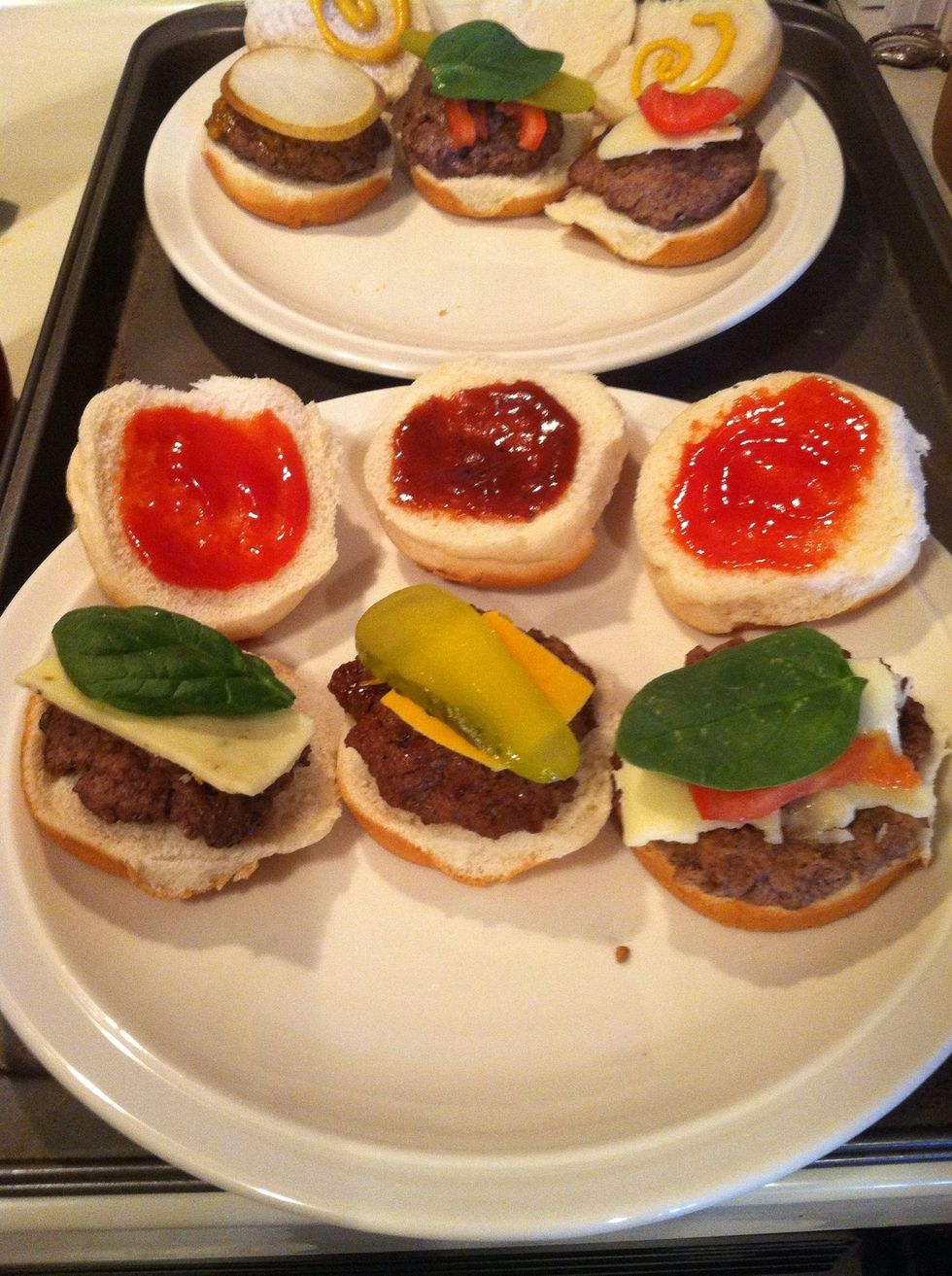 L to R: pepperjack cheese burger - ketchup, spinach, pepperjack; barbecue sauce burger - dill pickle, cheddar, BBQ sauce; spicy mustard burger - ketchup, spinach, tomato, mozzarella.