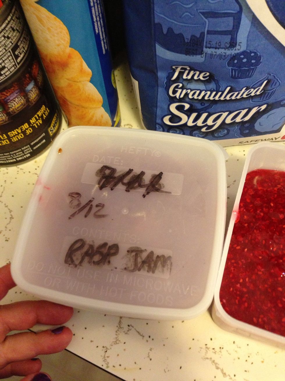 Label the top of your Jam containers. Wipe off the tops of the containers if needed. And then put the lids on the containers. Make sure they are closed tight.