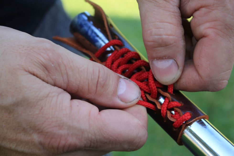 Laceing: Return to the beginning and tighten the laces by pulling on the lace emerging from the second set of holes. Using your fingers and thumbs work the lace until it is snug across the first holes