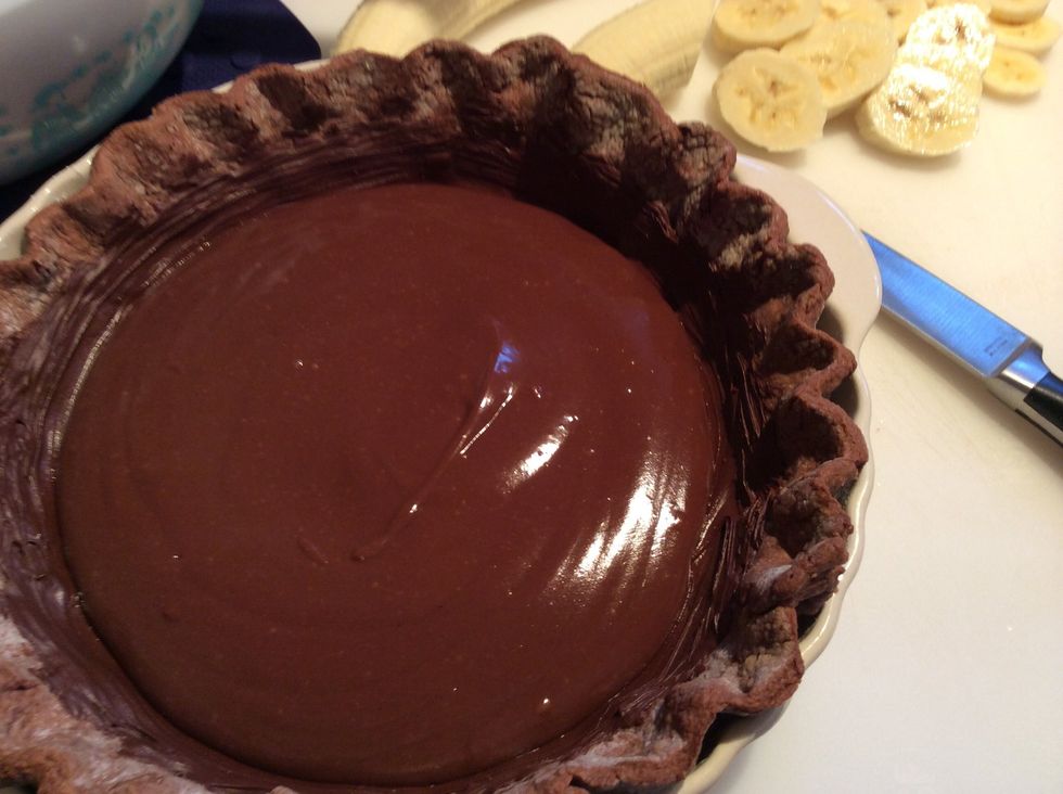 Ladle 8-12 ounces of pastry cream in to the pie shell.