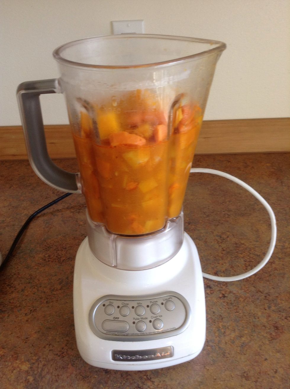 Ladle the soup into a blender (you may need to do more than one batch)