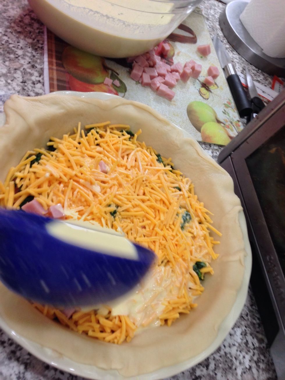 Ladle your egg mixture evenly over the two pie dishes.