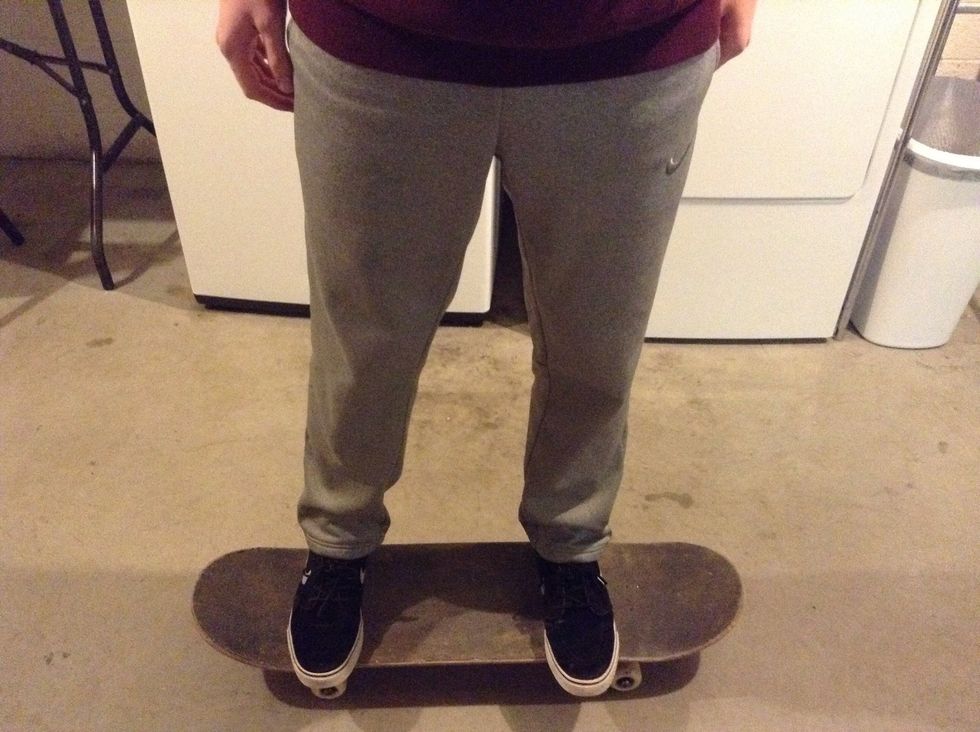 Land on your board with your feet on the bolts parallel to each other, and bend your knees.