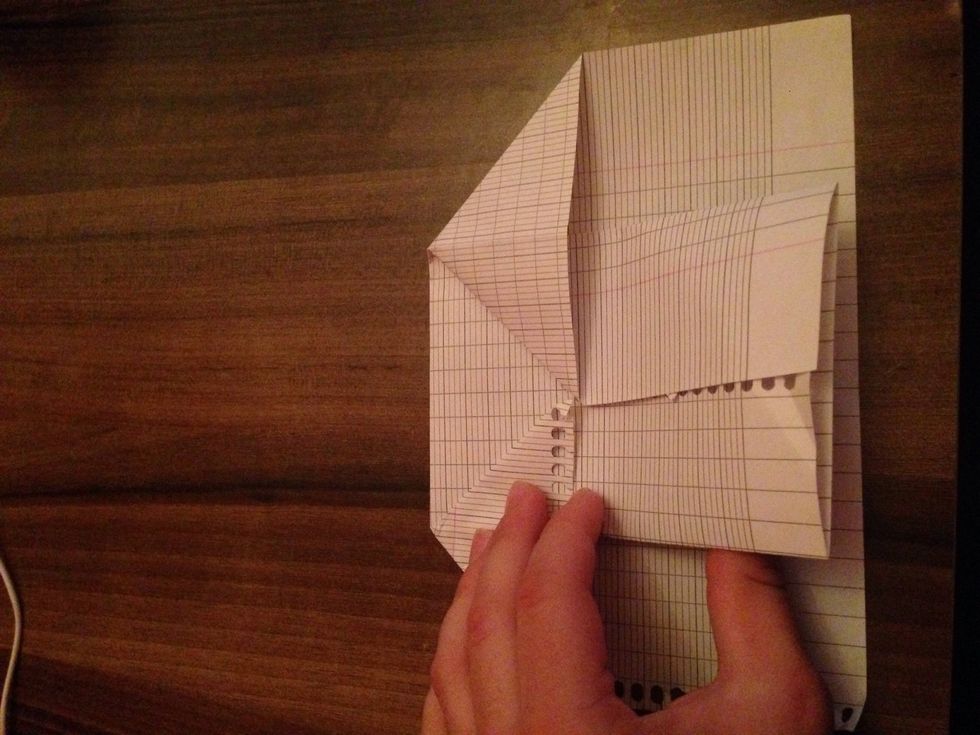 Lap the piece of the paper to top