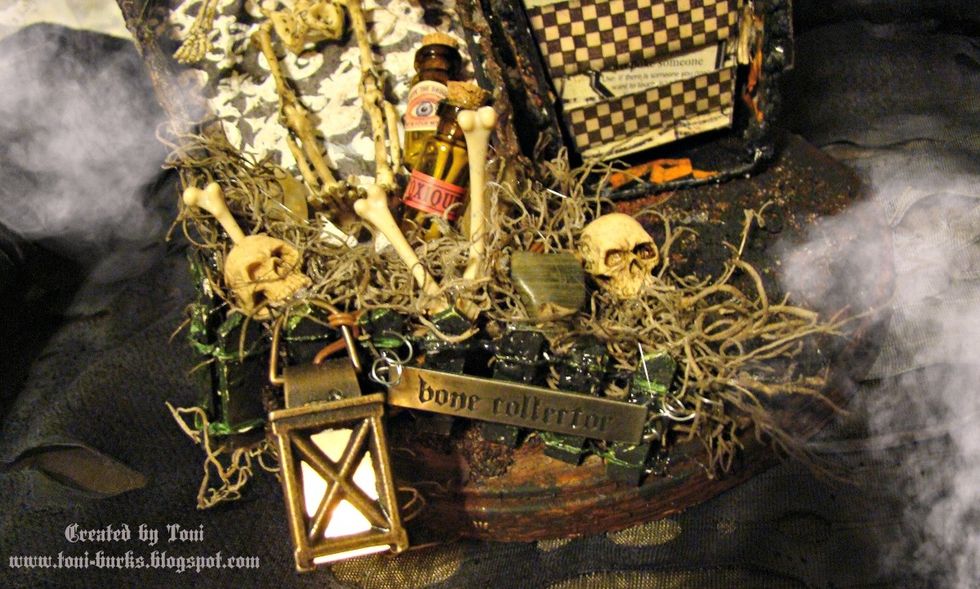 Last but not least, hook your lantern on the top of the fence as well as add your "Bone Collector" word band. Smudge Black Tuxedo on top to fill in the letters and wipe the top clean.