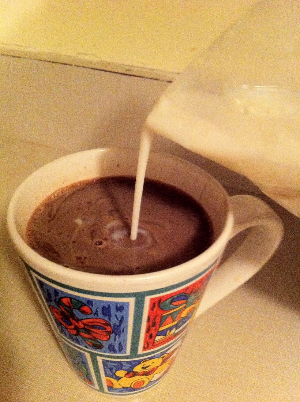 Last but not least, the milk. Put in as much as you please! But, not too much now, you don't want to put your hard work to waste by diluting the taste \ud83d\ude29 Stir once more!