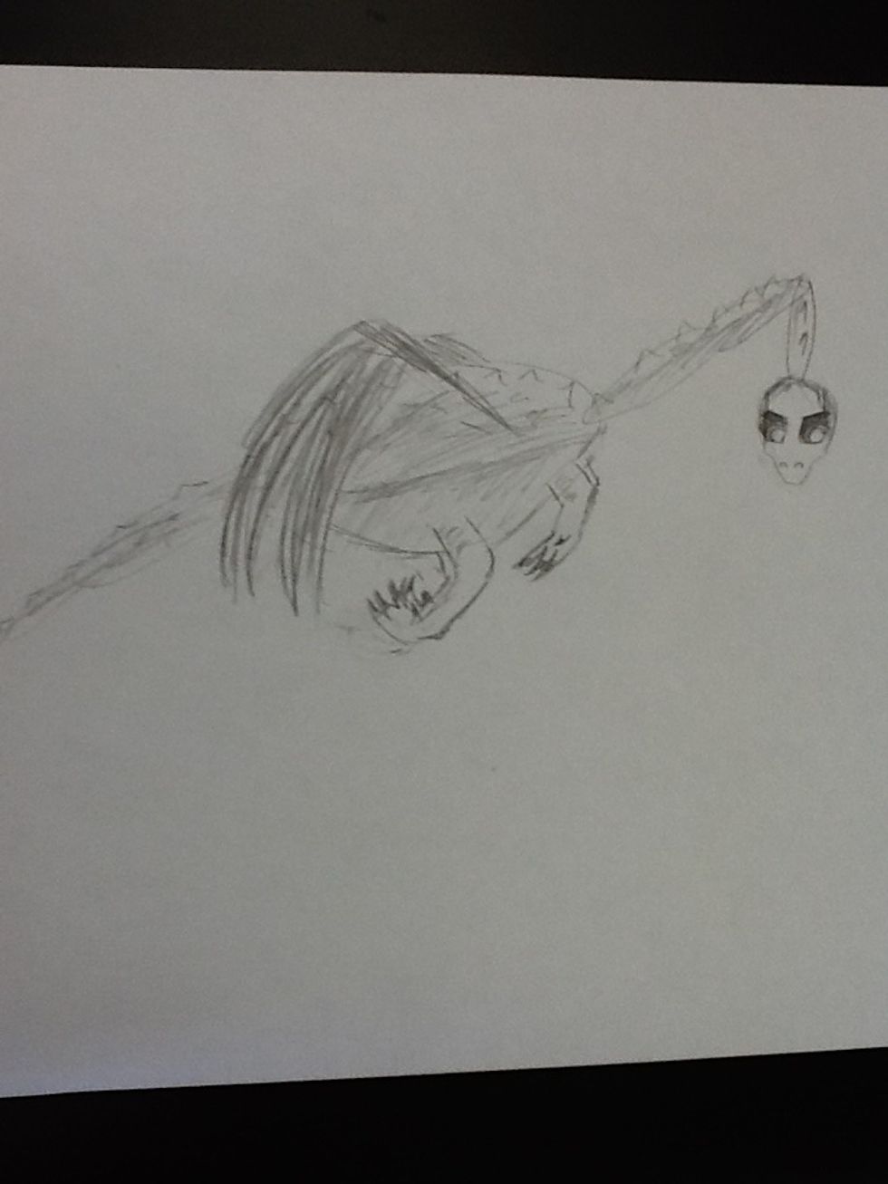 Last but not least, you erase some of the circle lines color in the dragon. Make sure you leave the belly lighter colored than the back. You can draw fire if you want.