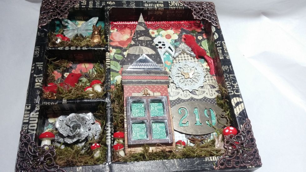 Last, I added a few more special finishing touches. Tiny brass elements (isn't that bunny cute) and some red Dresden borders add those special detailed touches that make this piece interesting.