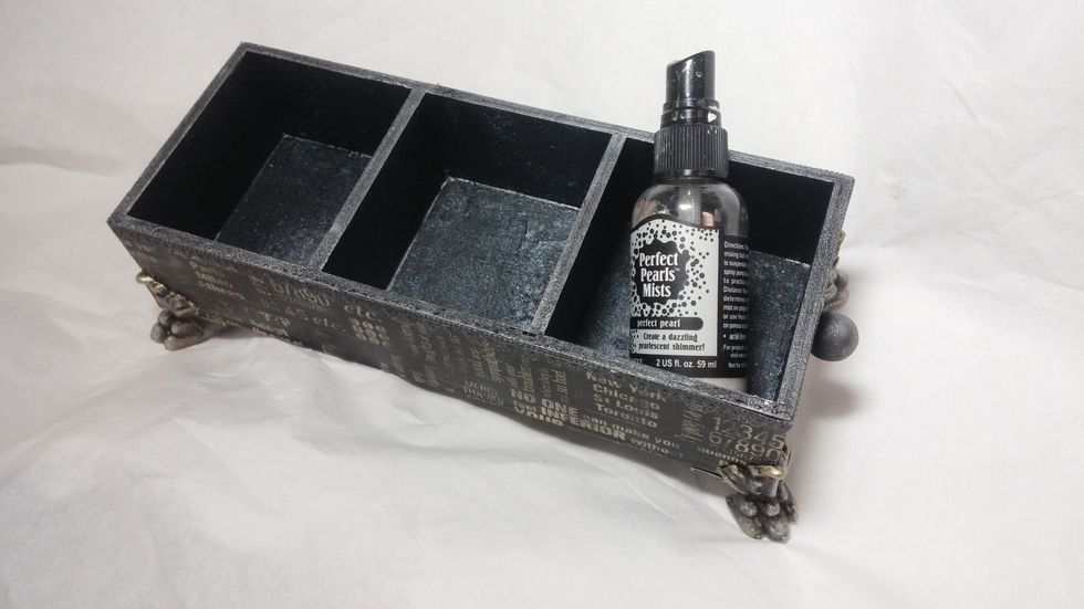 Last I glued the feet on and spritzed the inside chambers of the box with Perfect Pearls mist to create a metal effect.