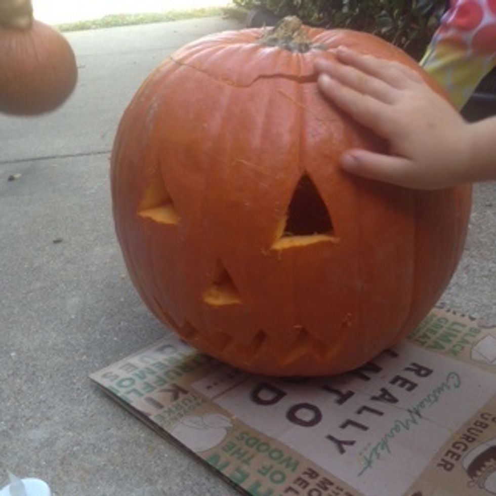Last put the top back on the pumpkin.