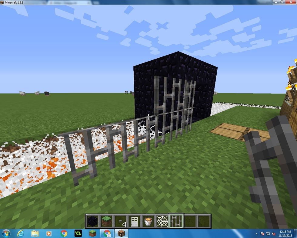 Last step is to take Iron Bars and place two up around the whole thing!