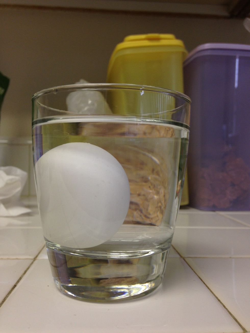 Last step : Place the egg in the water and wait a couple of seconds. If the egg floats up, the egg is rotten. If the egg sinks down on the surface level of the cup, it is still safe to eat!