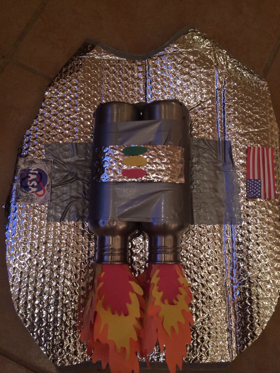 Last step use your creativity! I applied flames by gluing them to ends of paper toilet rolls and sticking the rolls in the water bottle. Decorate however you like!