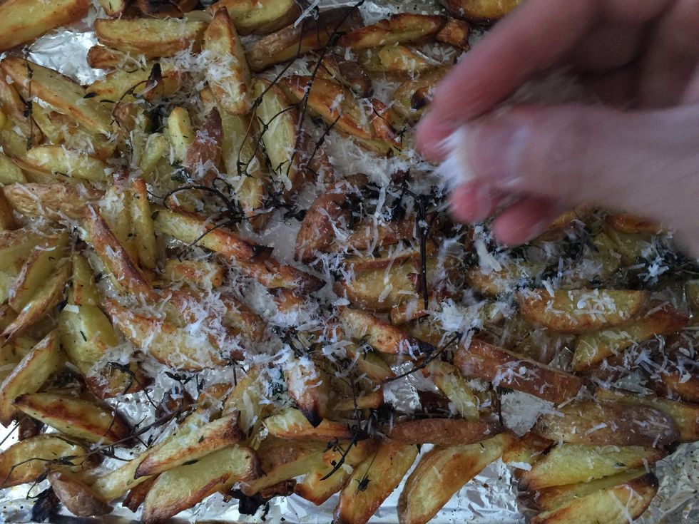 Lastly, add your freshly grated Parmesan cheese to the fries at the very end.