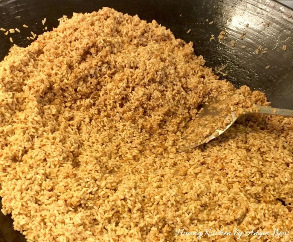 Lastly drained well and seasoned the glutinous rice. Then using low heat, briefly stir fry with shallot oil.