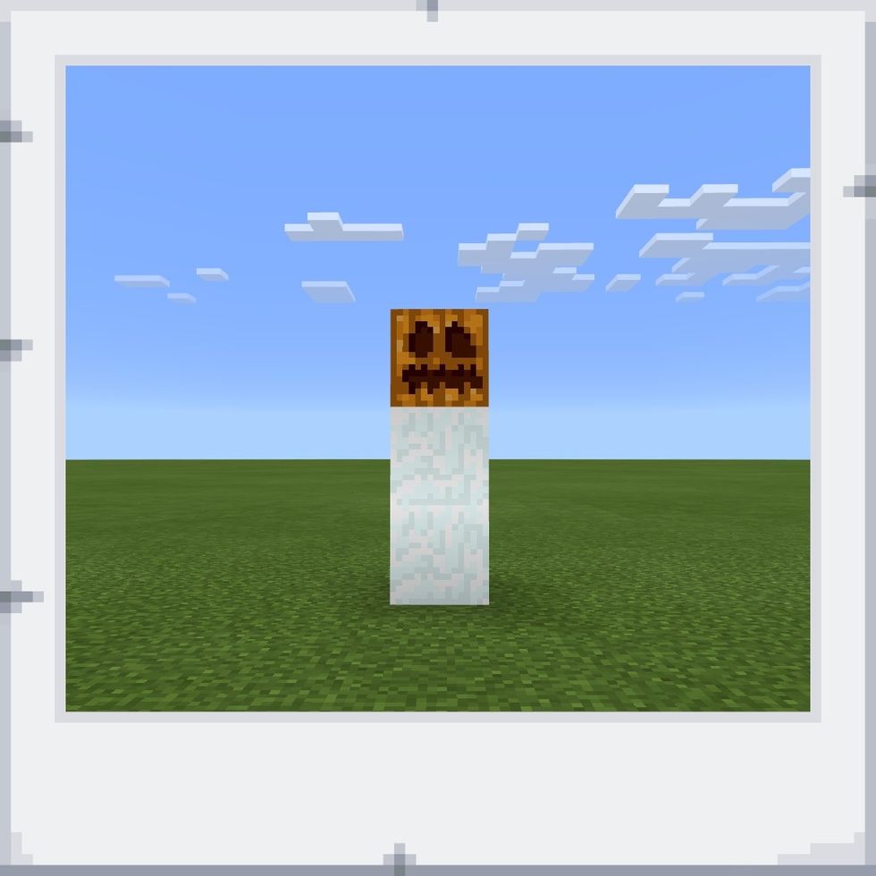 Lastly, place a pumpkin on top of the block of snow you placed on step 2.