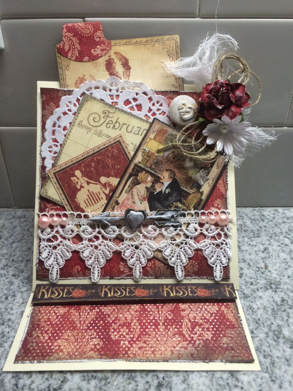 Lastly, the card was embellished with a paper doily, lace, buttons, twine, flowers, cheesecloth, pearl bling, Graphic 45 Place in Time cardstock & a pullout tag with a tab.