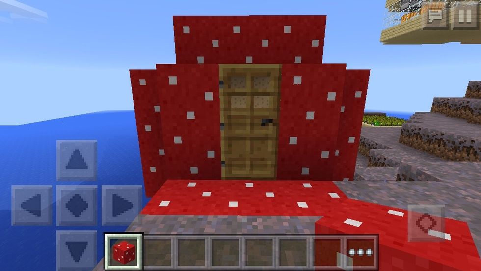 Lastly, this house is another mushroom house I didn't really add anything to this one because I really like the design of the mushroom  All I really added was the front door