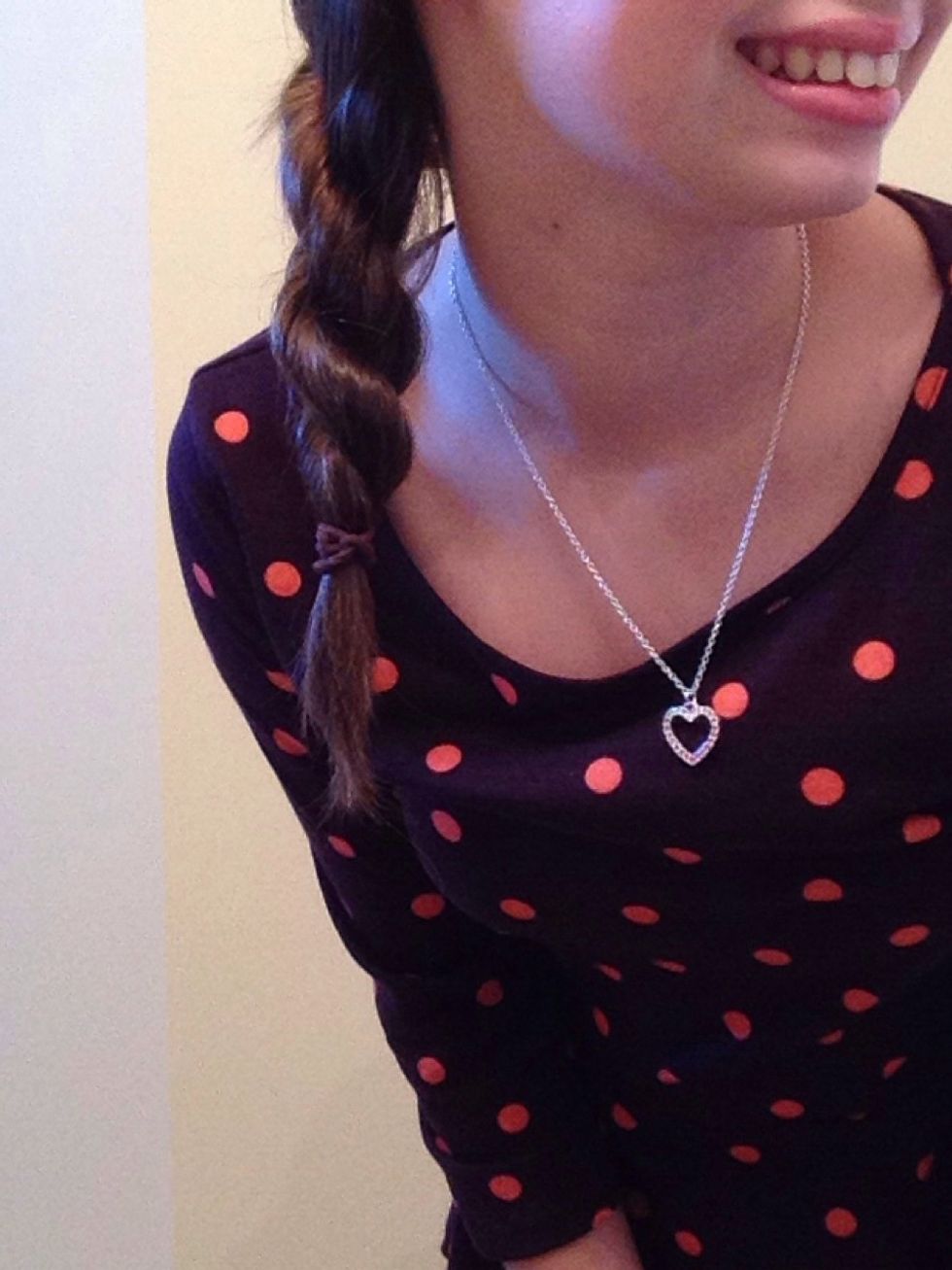 Lastly, twist both of the sections together, tie it, and finish off with some hairspray! I recommend this hairstyle for a bite to eat or shopping. This also looks cute with a scoop neck tee and jeans.