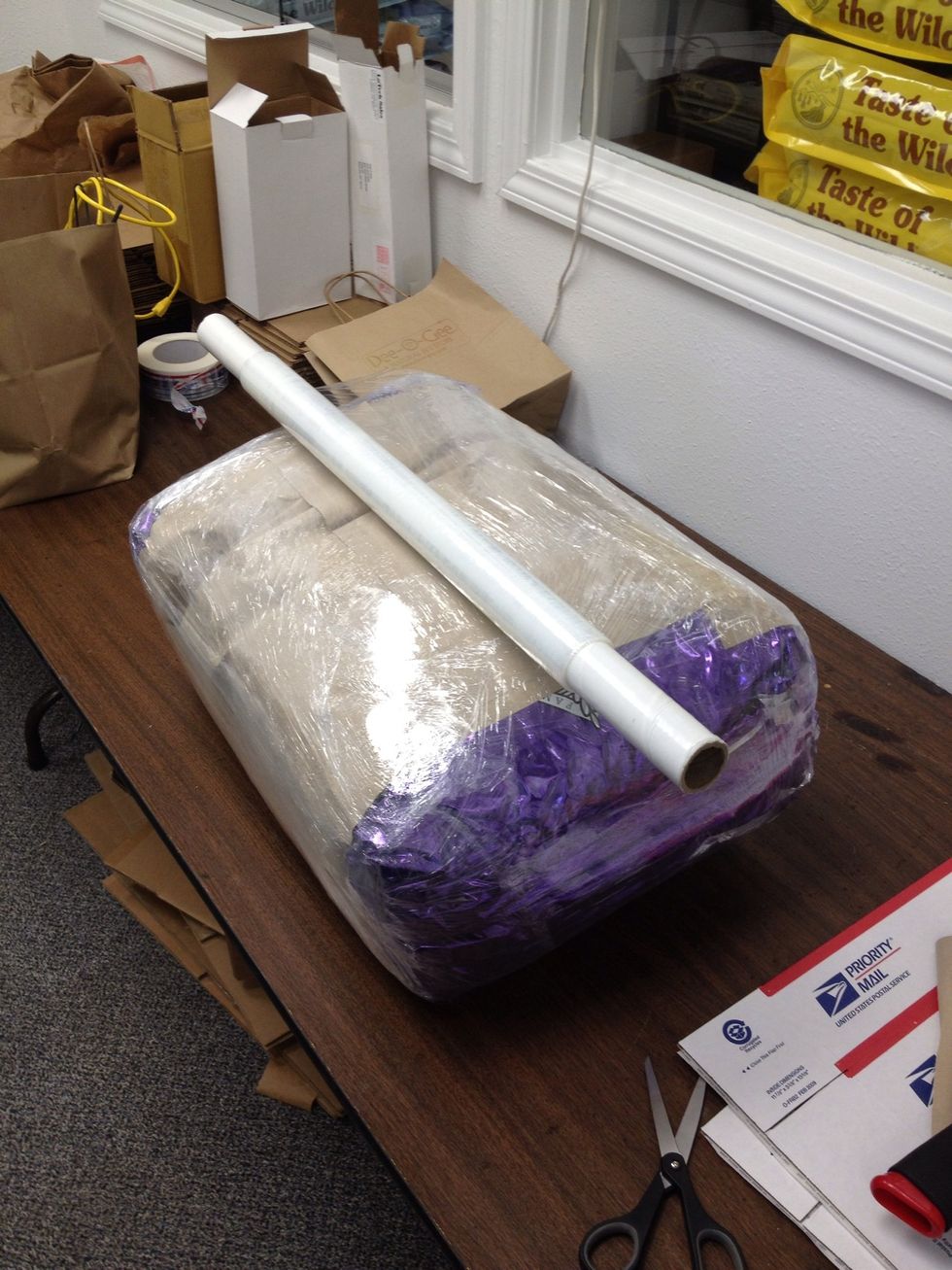 Lastly, wrap cellophane around the short way, 2-3 times. Make sure to pull the cellophane securely each time you "round the corner".