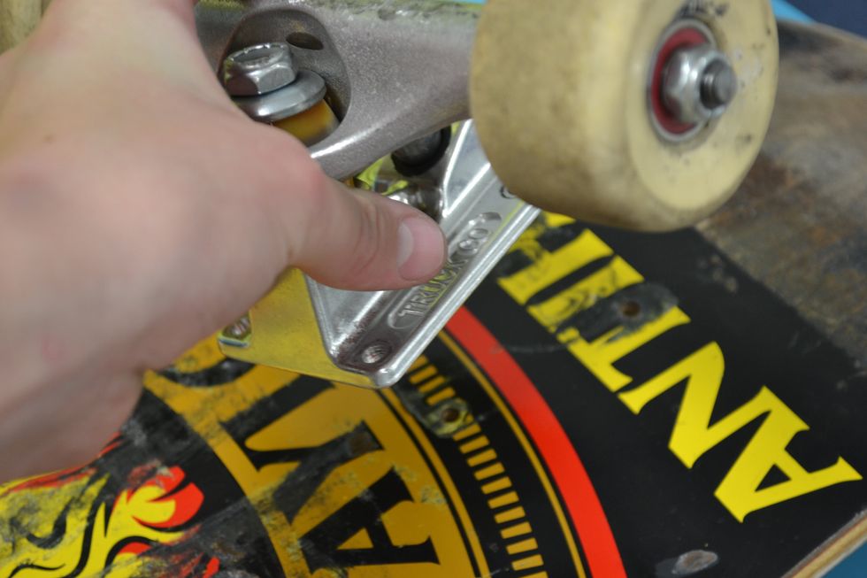 Lastly you need to screw the trucks onto the deck.