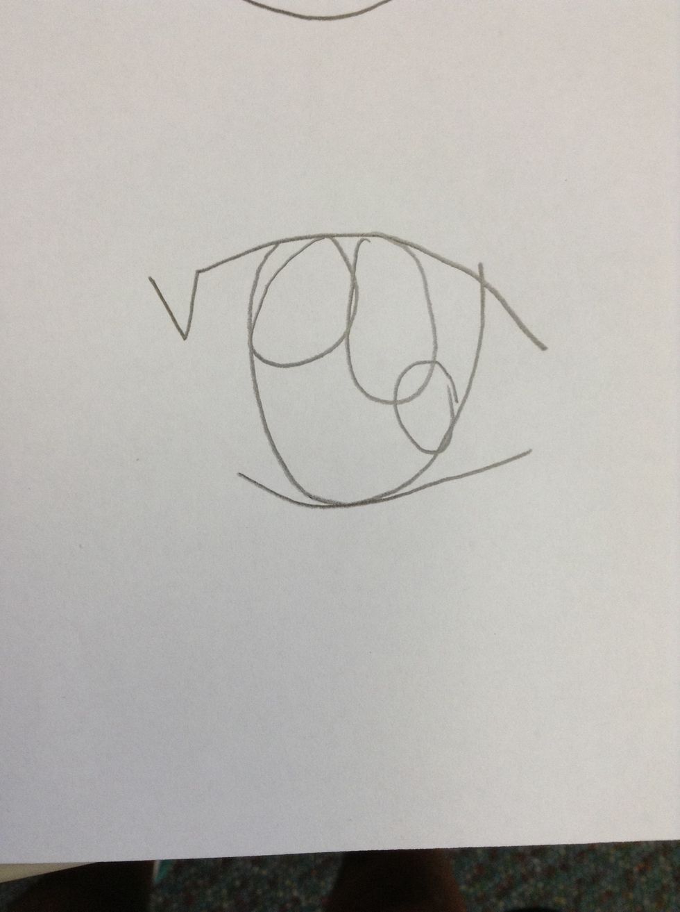 Later,draw an oval shape in the middle of the circles.