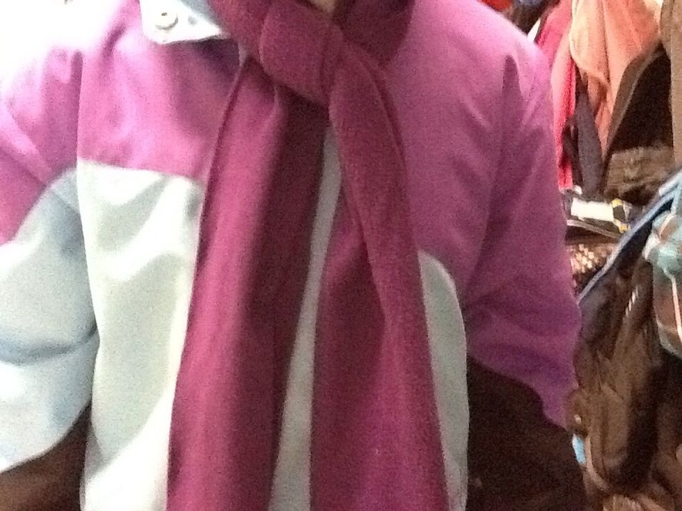 Later on, tie your scarf around your neck.