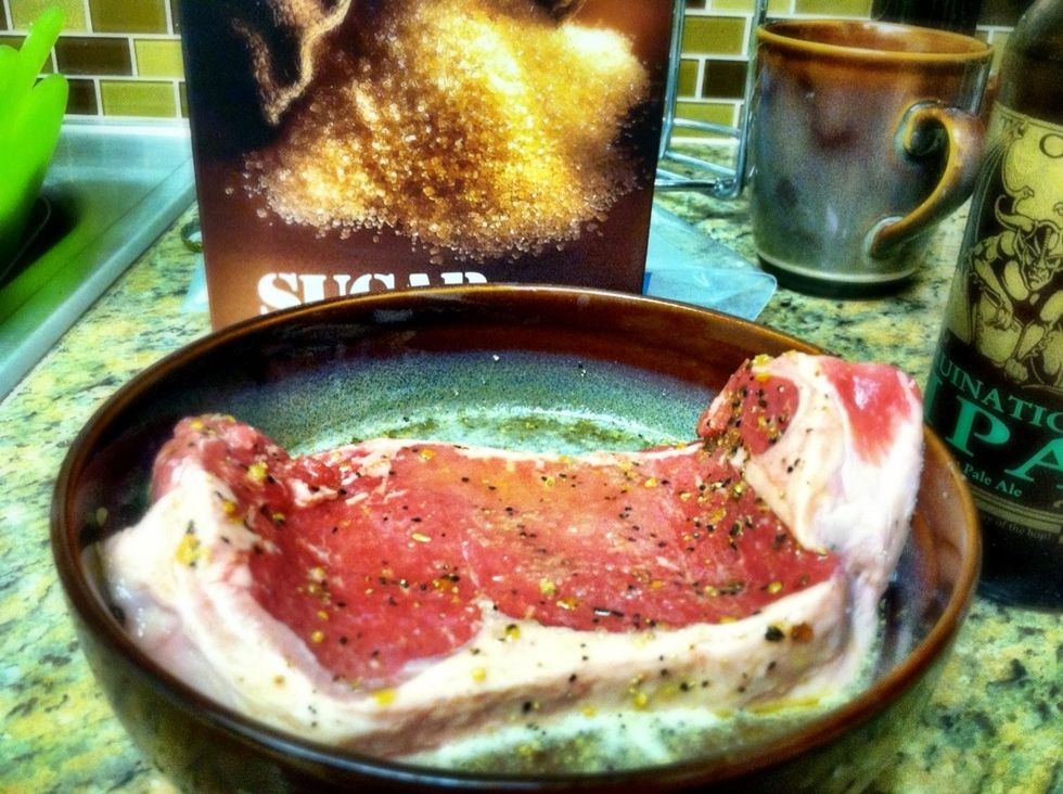 Lather the steak with olive oil and all acquired spices, then submerge the semi marinated steak into a bowl consisting of the sugar and IPA
