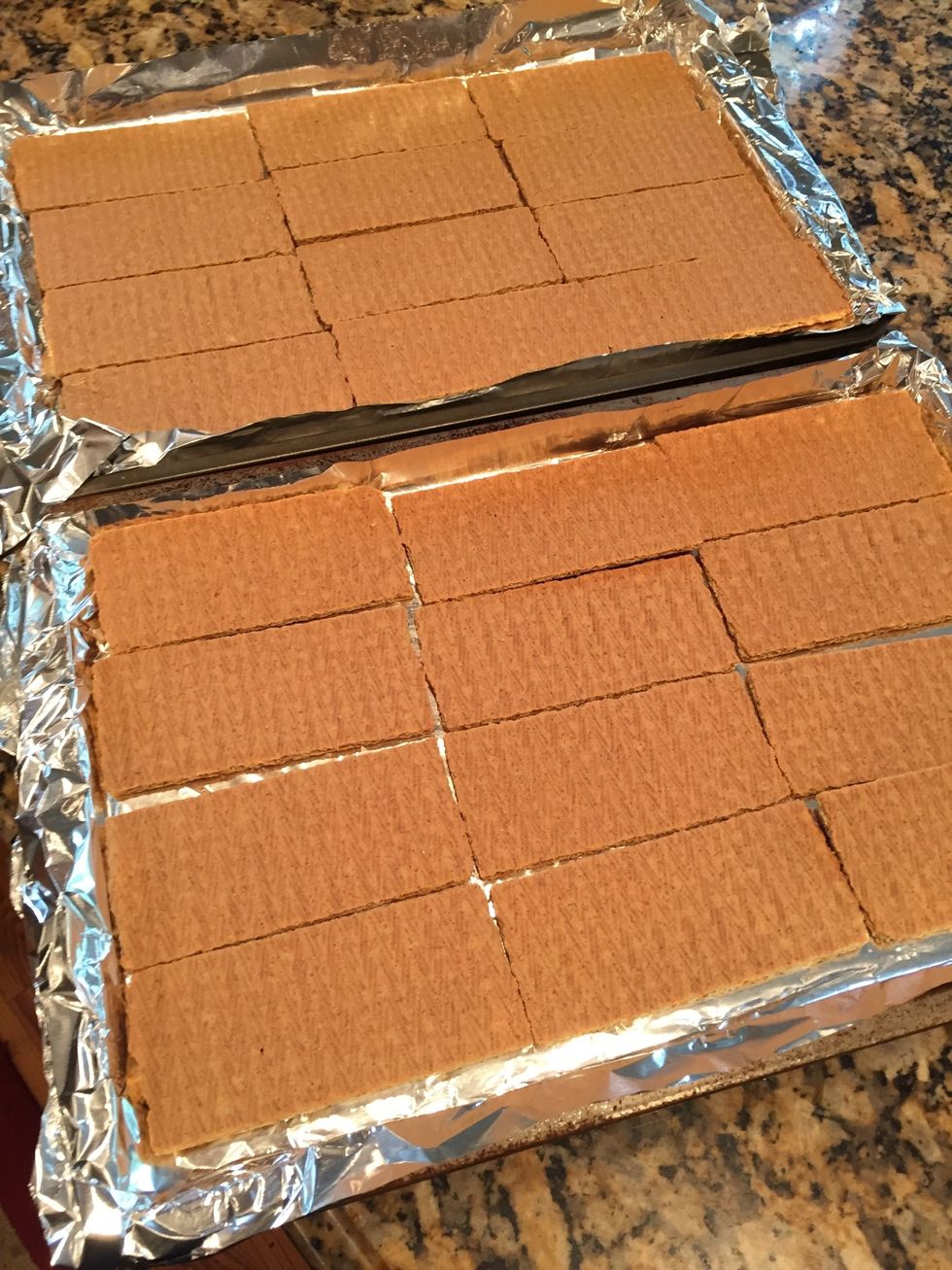 Lay 12 whole Graham crackers on each sheet pan. They will fit perfectly